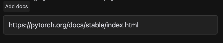 图片展示的是添加文档URL的操作界面。上方有“Add docs”按钮，下方输入框内显示网址“https://pytorch.org/docs/stable/index.html”。该图片与上下文紧密相关，上下文提到要添加文档条目，使用@符号从下拉菜单中选择Docs，此图即为插入URL后的界面，后续可为文档条目命名，如添加PyTorch文档示例。